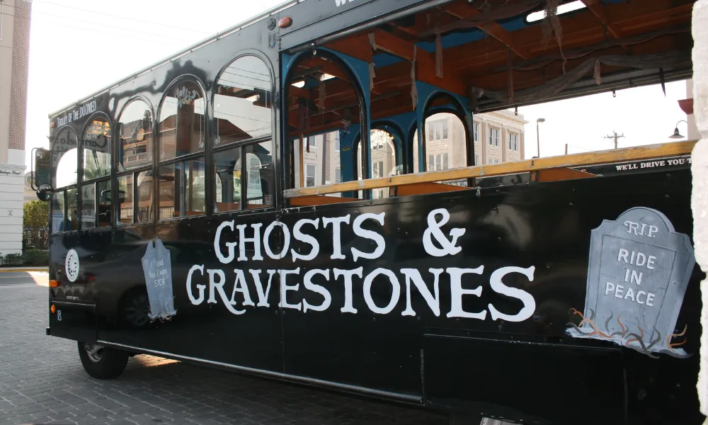 Black trolley with "Ghosts and Gravestones" logo on the side